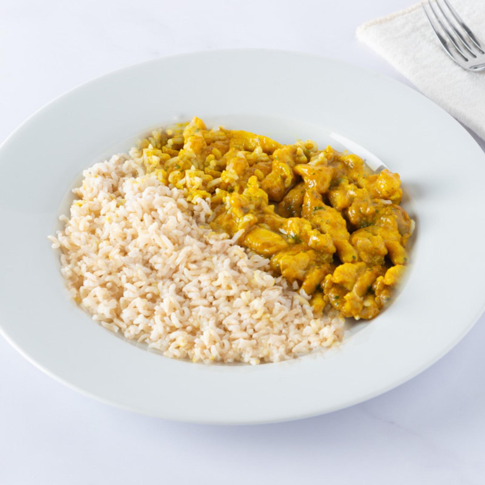 Bocconcini di pollo al curry con riso BIO