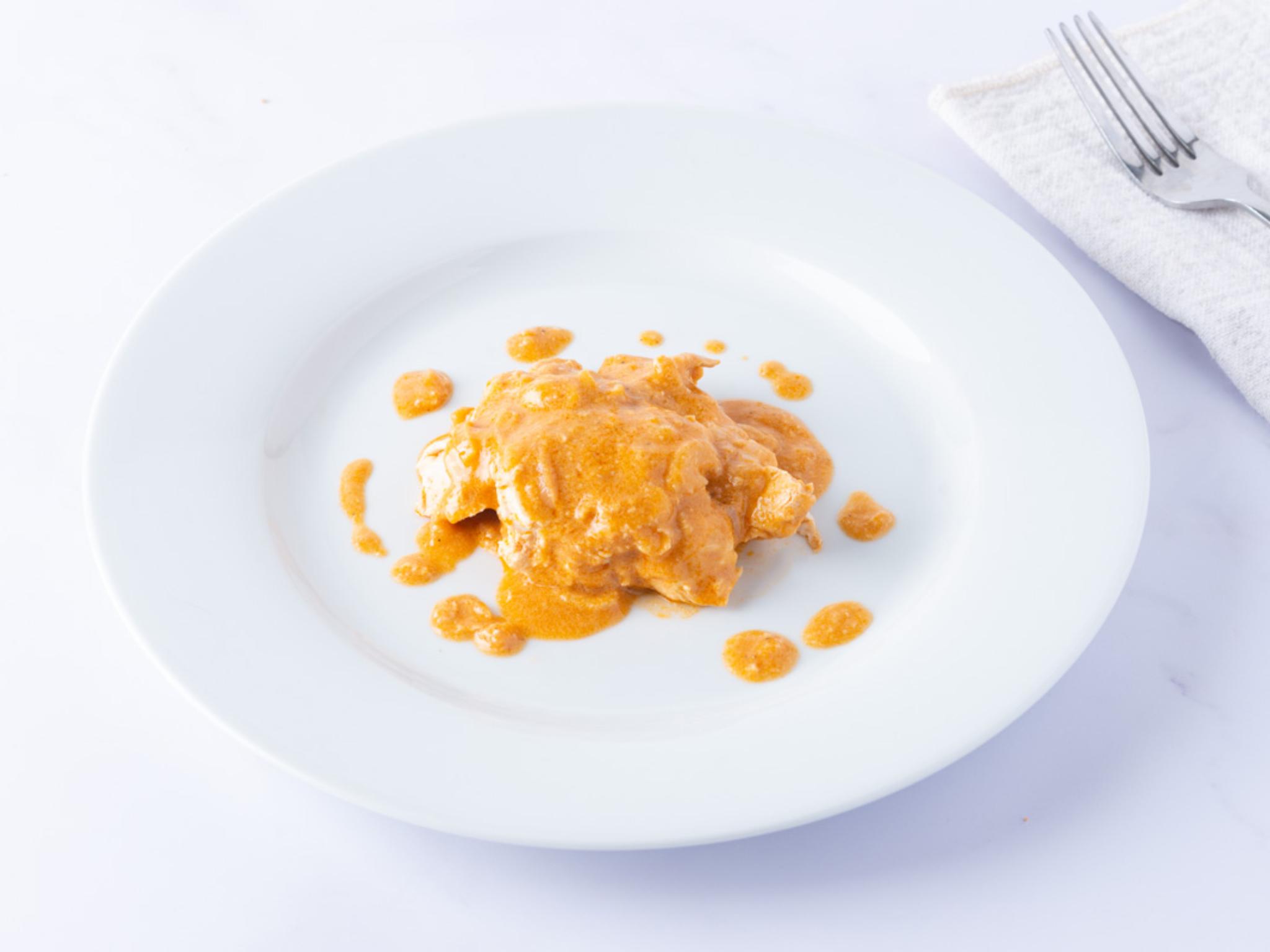 Pollo in salsa di cocco e arachidi
