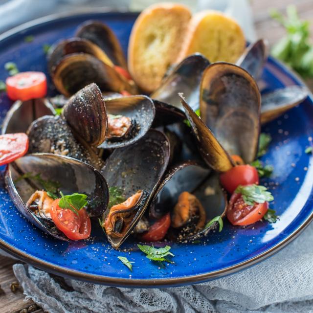 Impepata di cozze con i pomodorini